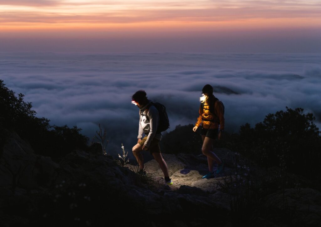 Image of two hikers at night.