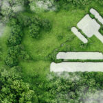 Illustration representing the Rights of Nature movement, showing rivers, forests, and wildlife with legal scales in the background.
